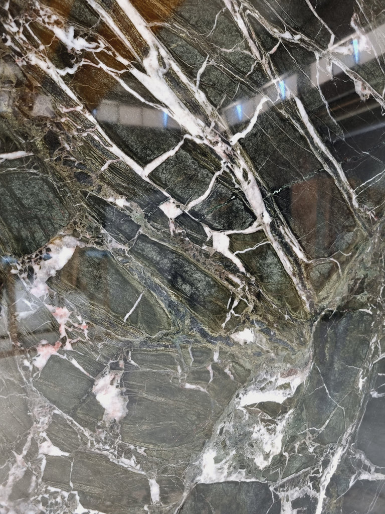 Dark green marble with white veining close up