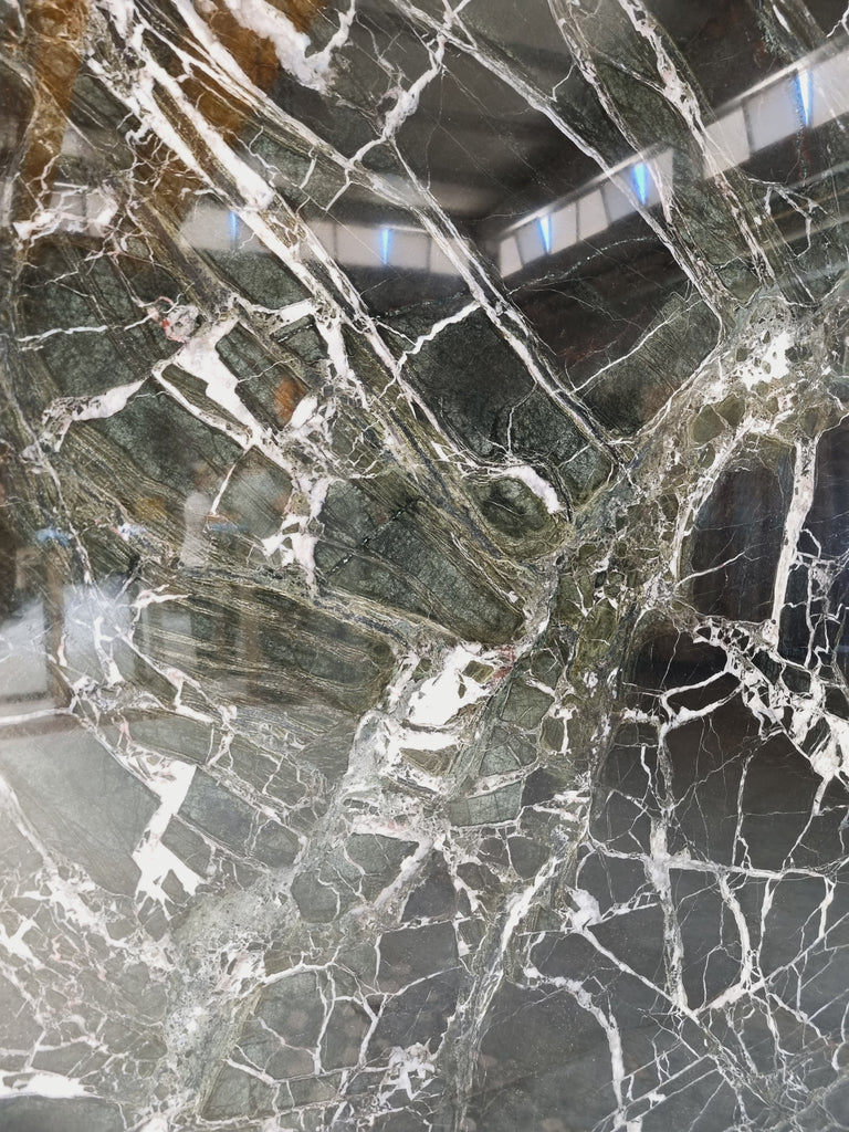 Dark green marble with white veining close up